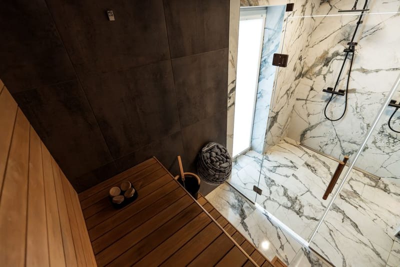 Tiled steam room interior with seating