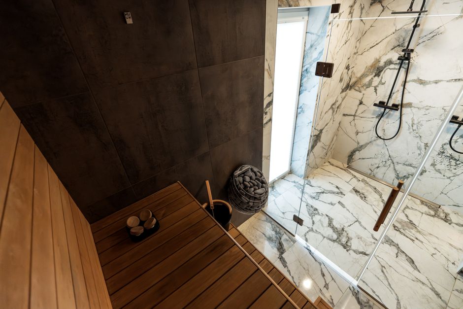 Tiled steam room interior with seating